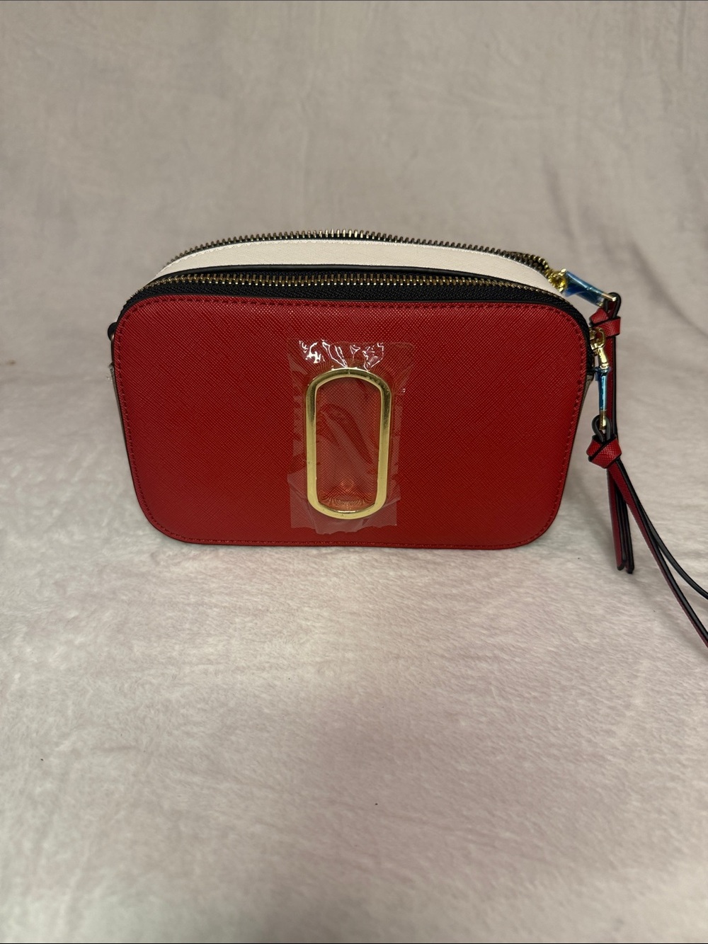 Red and White Compact Crossbody Bag with Gold Accent